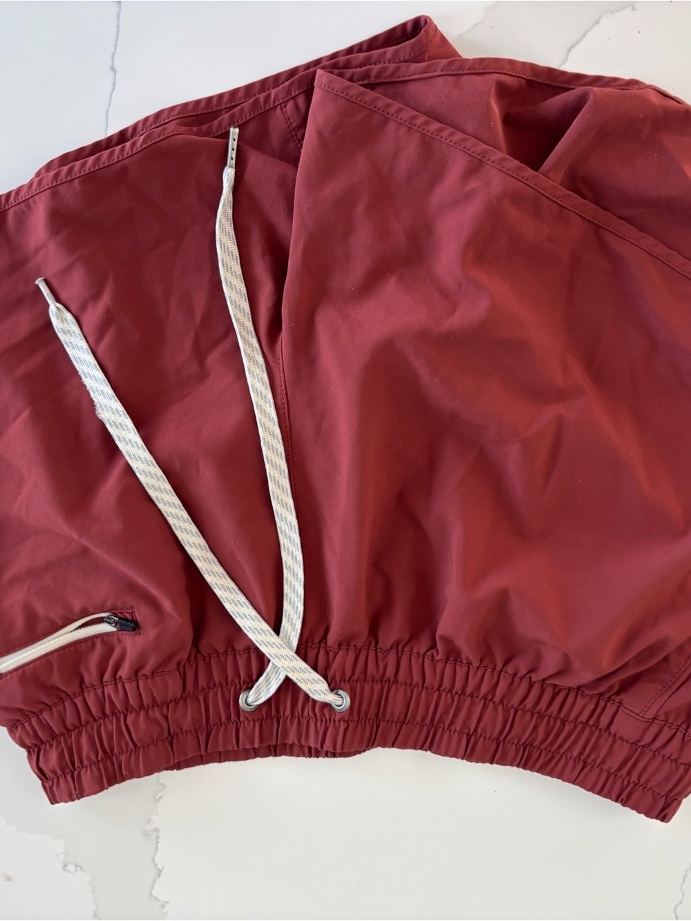 Vuori Women's Athletic Shorts in Deep Red with White Drawstring